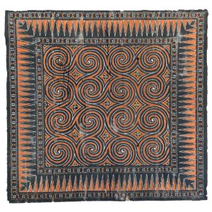 An authentic rectangular antique side wall panel from a Toraja Tongkonan house, featuring hand-carved and painted traditional geometric Pa'ssura motifs