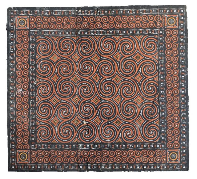 Hand-carved traditional Toraja house panel with authentic black and orange spiral Passura motifs from Sulawesi Indonesia